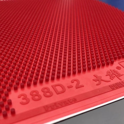 Close-up of red Saviga 388D-2 rubber showing its long-pips surface