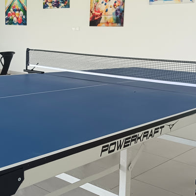 Side view of the Powerkraft Championship Edition table showing its legs and wheels