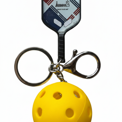 Yellow-ball pickleball keychain with a patterned paddle, metal ring and clasp